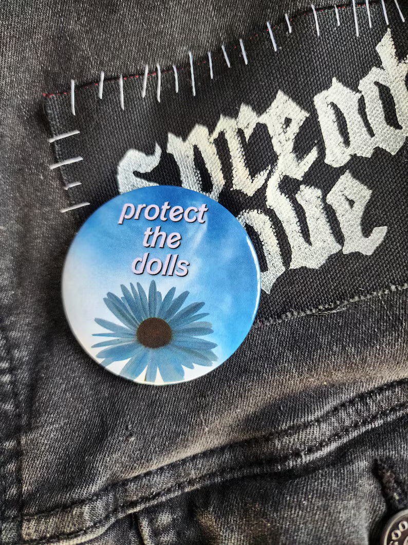 protect the dolls | pin back buttons | 2.25" | flower sky photography