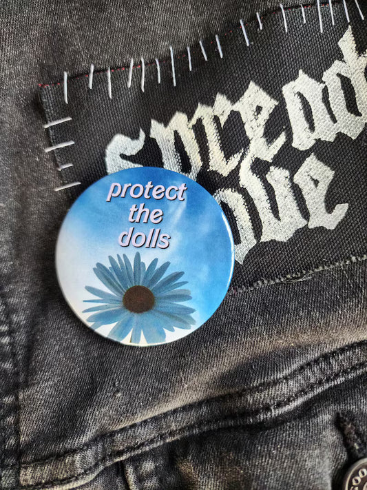 protect the dolls | pin back buttons | 2.25" | flower sky photography